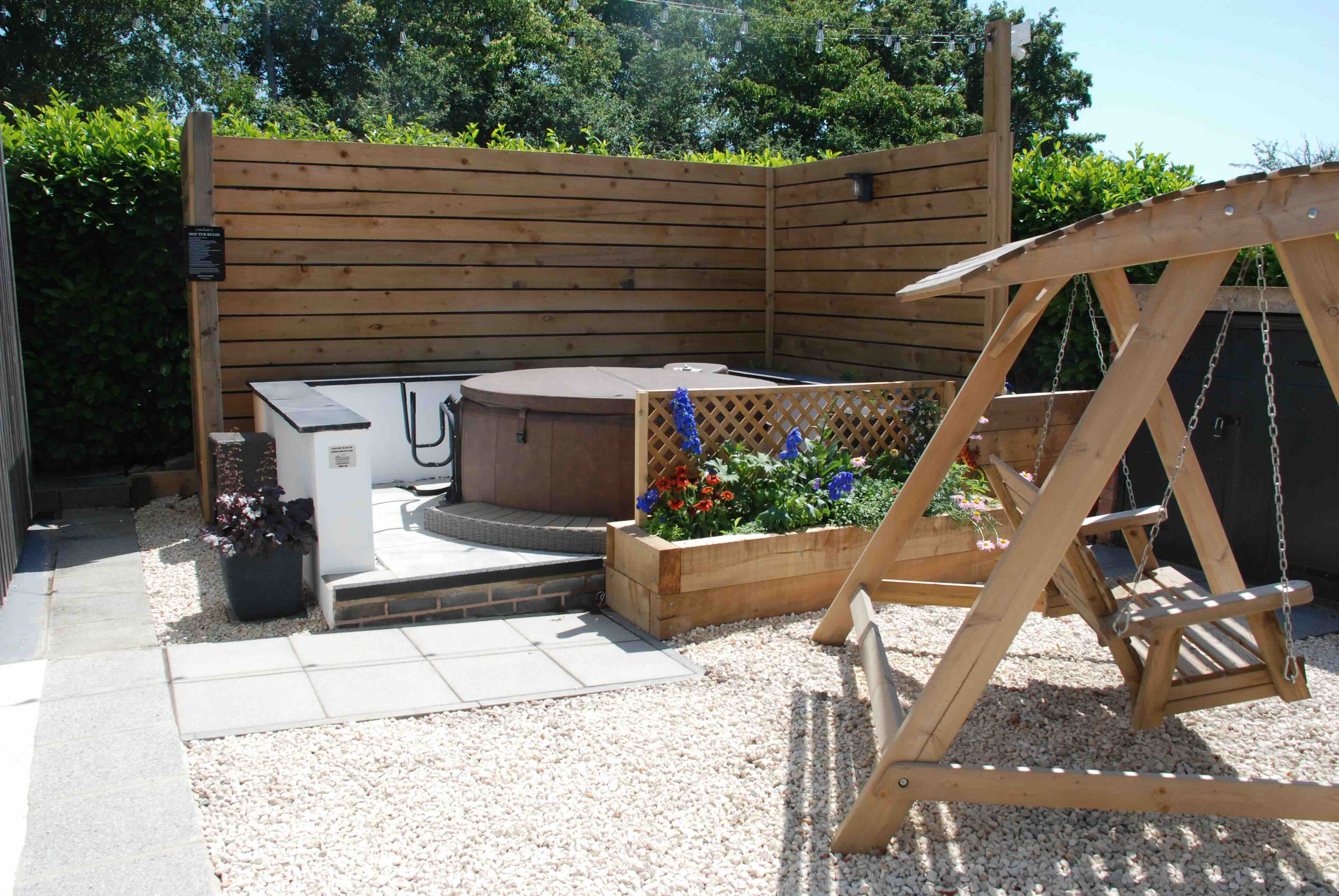 Outdoor hot tub area at Oldwyche Barns